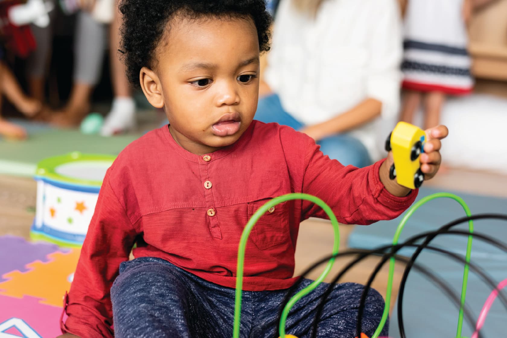 Three-year-olds playing with toys